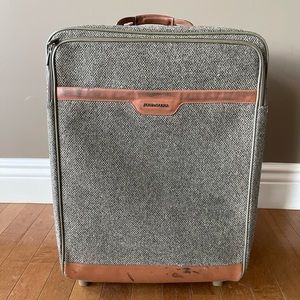 Hartmann gently used suitcase with real leather trim, accents and handles.